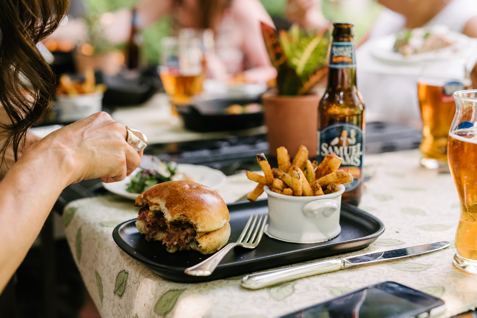 Guests indulging in the burger, beer and fries